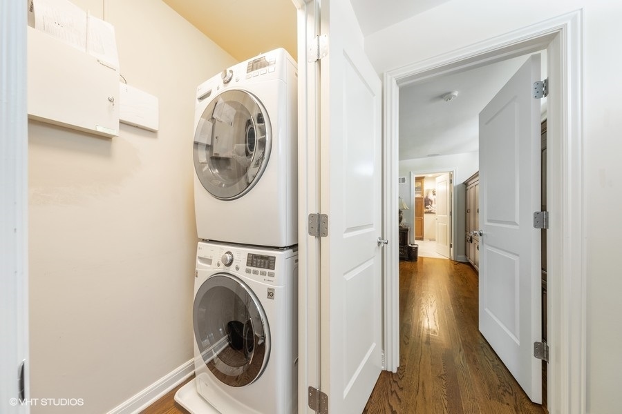 6547 South County Line Road Burr Ridge, IL 60527 - Photo 11 of 24 a view of a hallway with washer and dryer