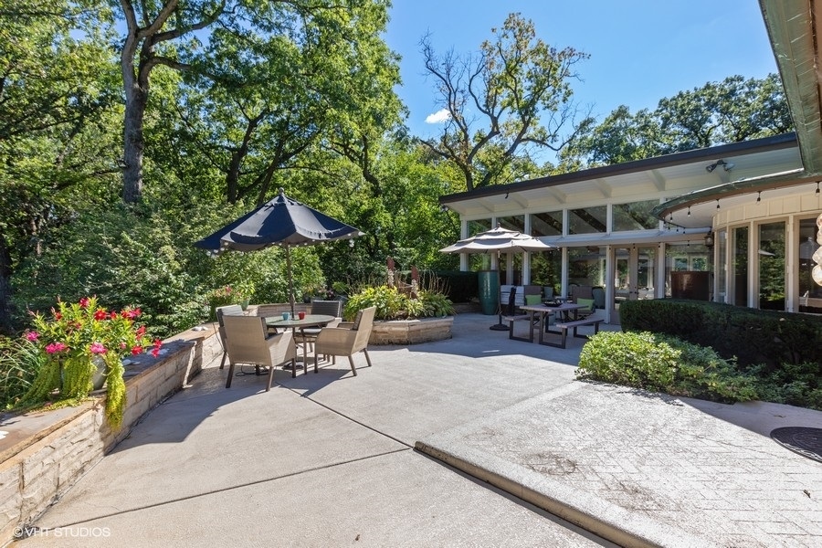 6547 South County Line Road Burr Ridge, IL 60527 - Photo 14 of 24 a view of a house with sitting area and garden