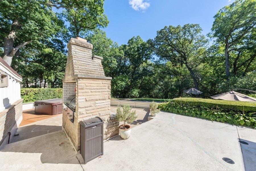 6547 South County Line Road Burr Ridge, IL 60527 - Photo 19 of 24 a view of backyard with outdoor seating and trees