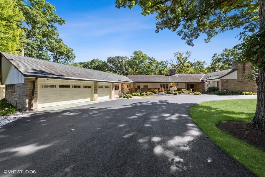 6547 South County Line Road Burr Ridge, IL 60527 - Photo 2 of 24 a view of a house with a yard