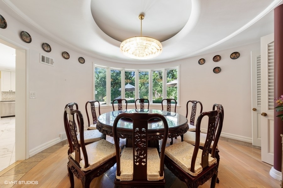6547 South County Line Road Burr Ridge, IL 60527 - Photo 6 of 24 a view of a dining room with furniture and chandelier