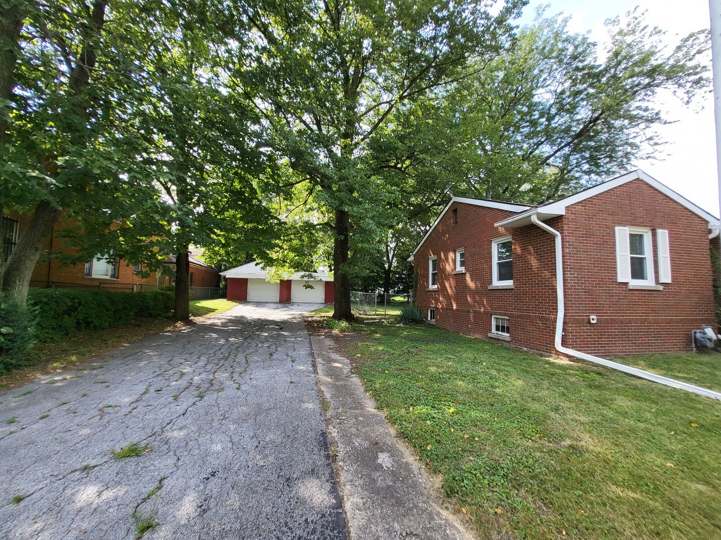3328 Butler Avenue Steger, IL 60475 - Photo 4 of 22 a front view of a house with garden