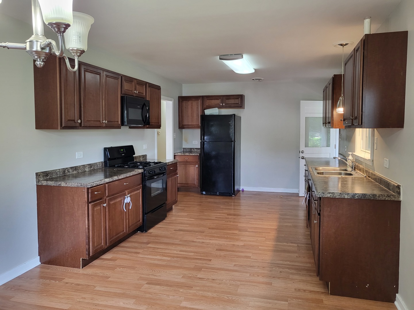 3328 Butler Avenue Steger, IL 60475 - Photo 9 of 22 a kitchen with stainless steel appliances granite countertop a refrigerator a stove top oven a sink and dishwasher