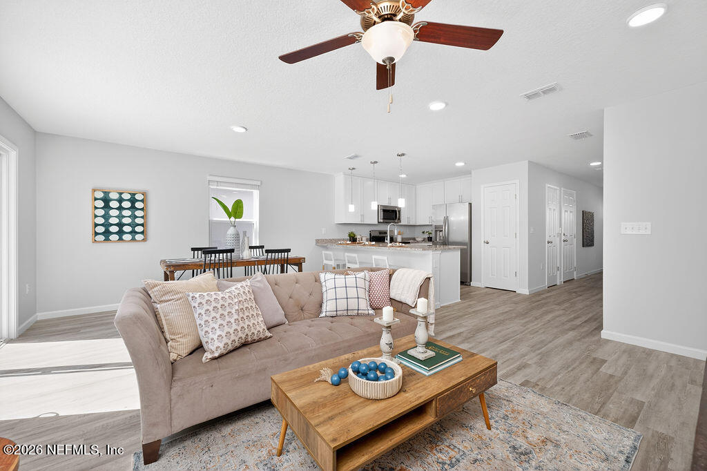 857 Jackson Road Jacksonville, FL 32225 - Photo 13 of 29 a living room with furniture and kitchen view