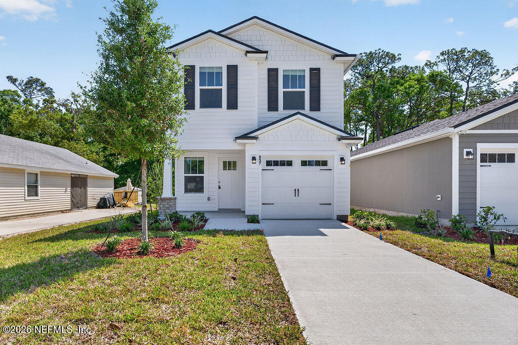 857 Jackson Road Jacksonville, FL 32225 - Photo 4 of 29 front view of a house with a yard
