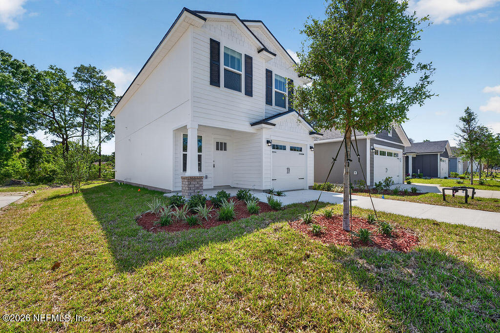 857 Jackson Road Jacksonville, FL 32225 - Photo 5 of 29 a front view of a house with garden