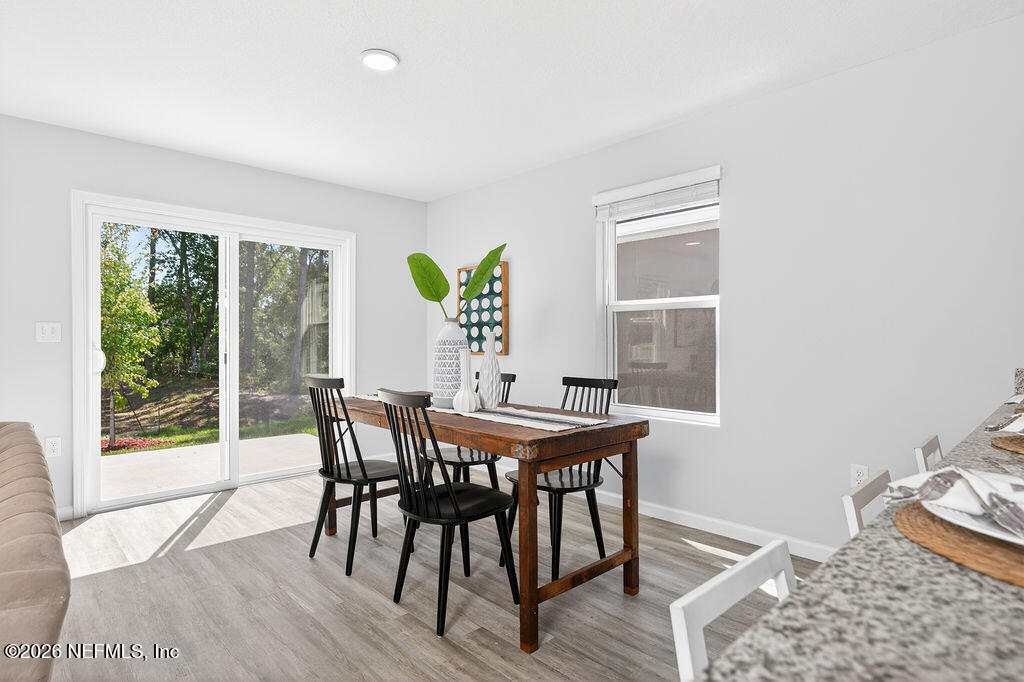 857 Jackson Road Jacksonville, FL 32225 - Photo 10 of 29 a view of a dining room with furniture window and outside view