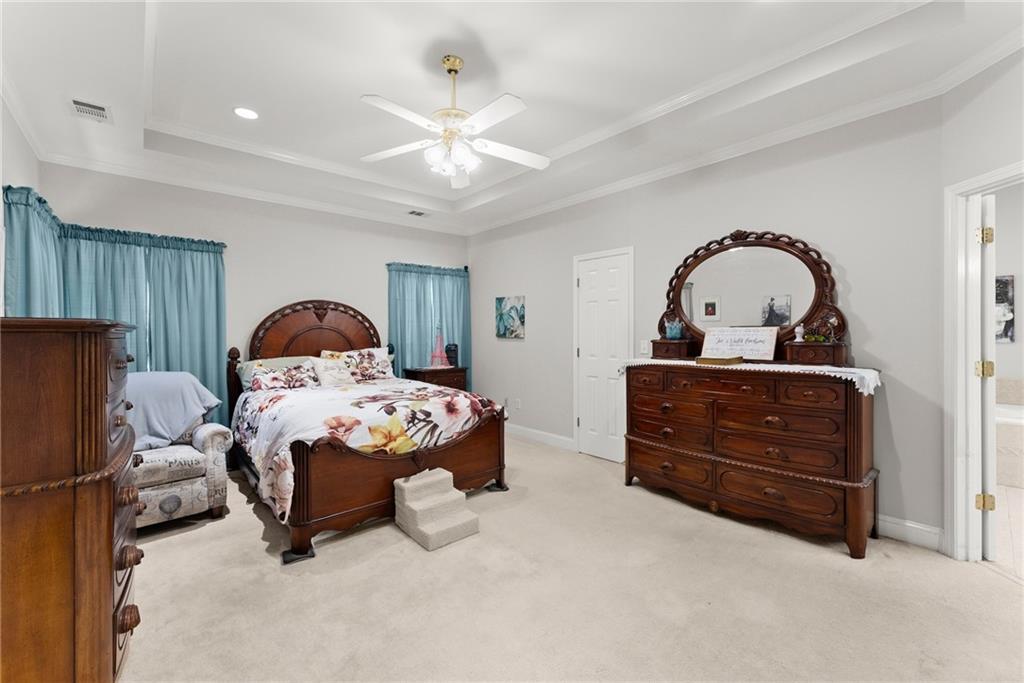 1617 Edwards Mill Road Ball Ground, GA 30107 - Photo 14 of 42 a bedroom with a bed and a dresser