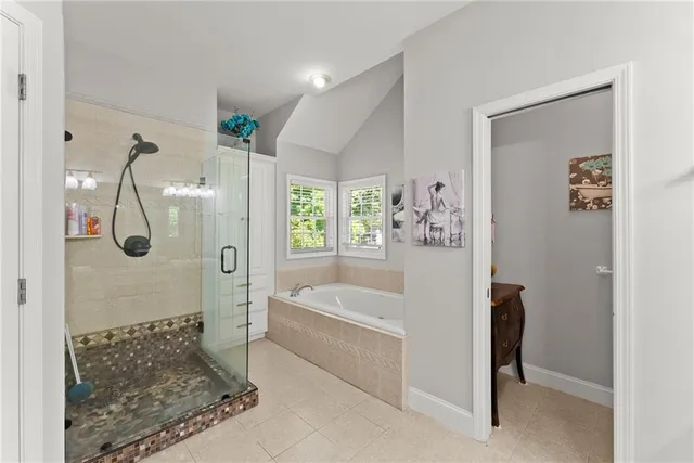 a bedroom with bed and a window