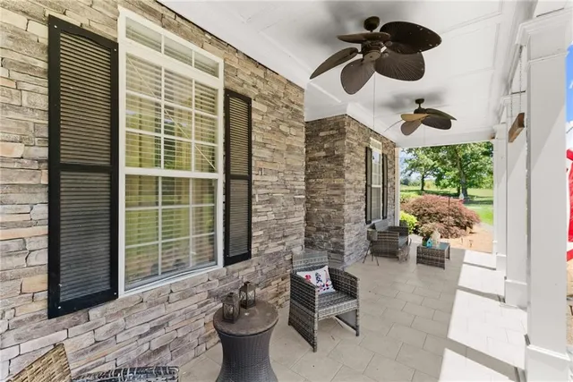 a view of kitchen with granite countertop living room