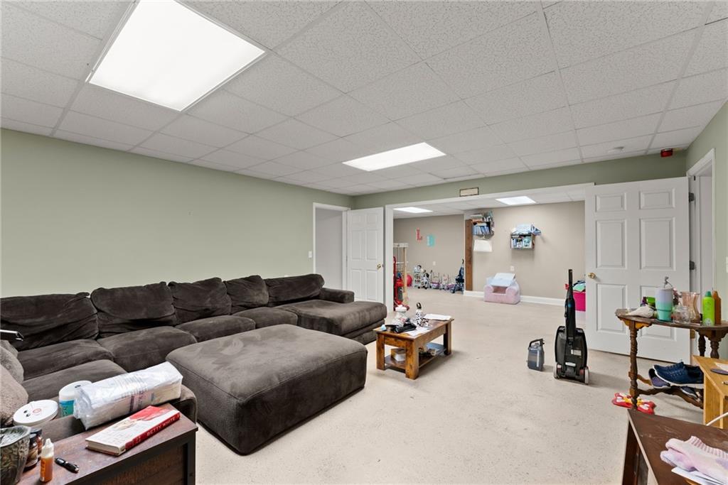 1617 Edwards Mill Road Ball Ground, GA 30107 - Photo 24 of 42 a living room with furniture and a window