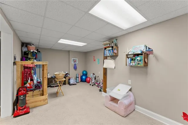 an aerial view of residential houses with outdoor space and street view