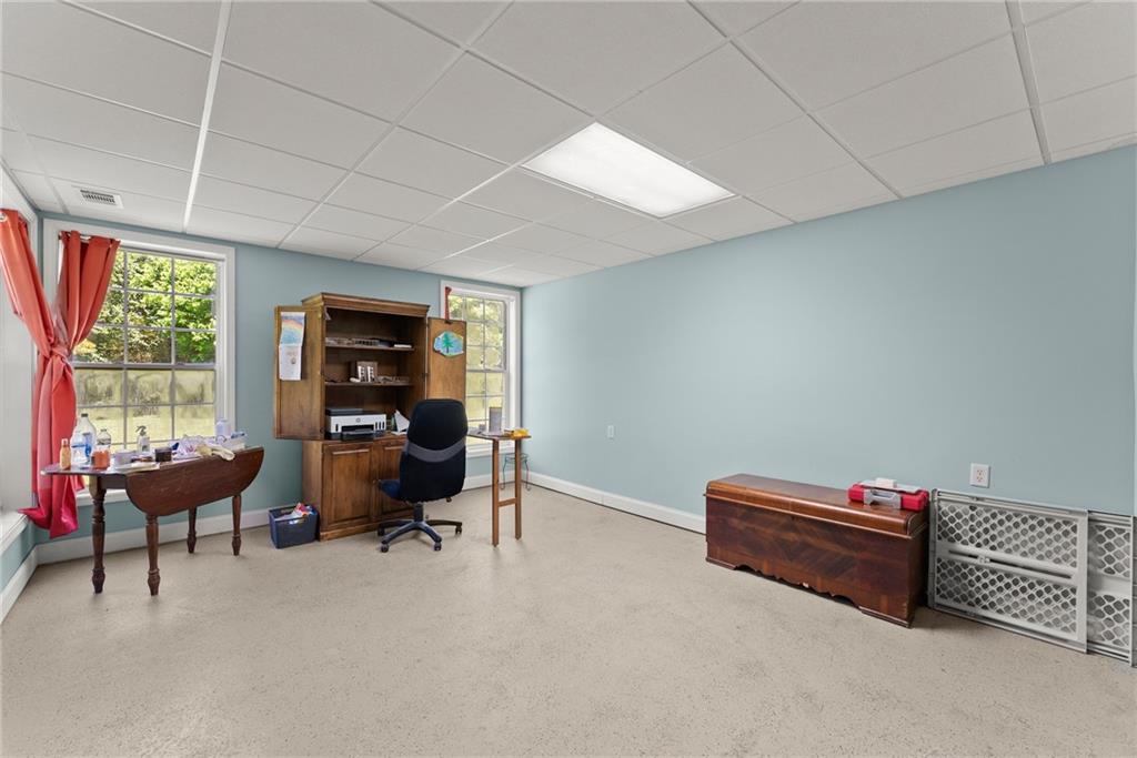 1617 Edwards Mill Road Ball Ground, GA 30107 - Photo 31 of 42 a view of a livingroom with workspace and a window