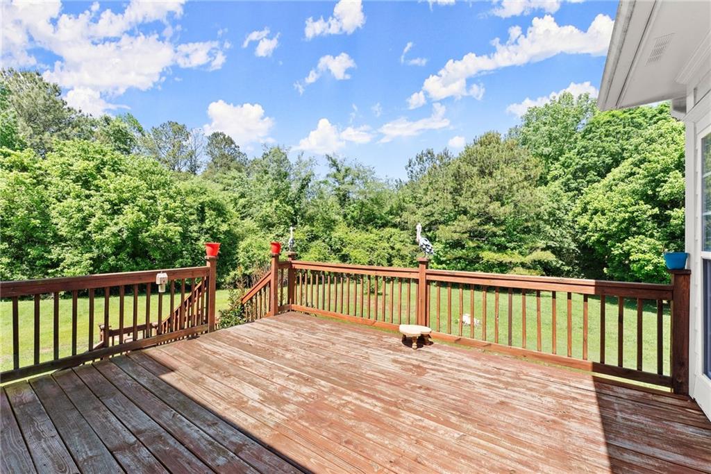 1617 Edwards Mill Road Ball Ground, GA 30107 - Photo 36 of 42 a terrace view with wooden floor and fence