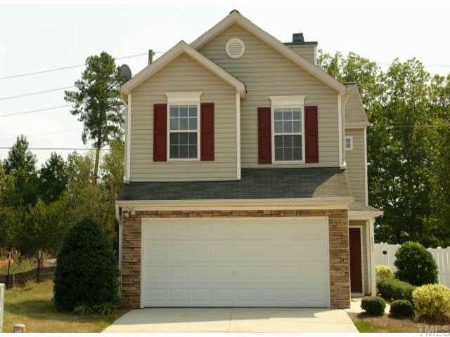 5525 Gateway Place Raleigh, NC 27617 - Photo 1 of 10 a front view of a house with a garden