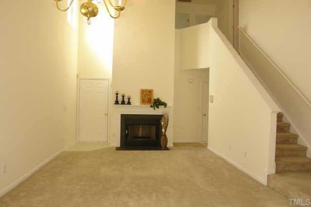 5525 Gateway Place Raleigh, NC 27617 - Photo 3 of 10 a view of a hallway with wooden floor and a bathroom