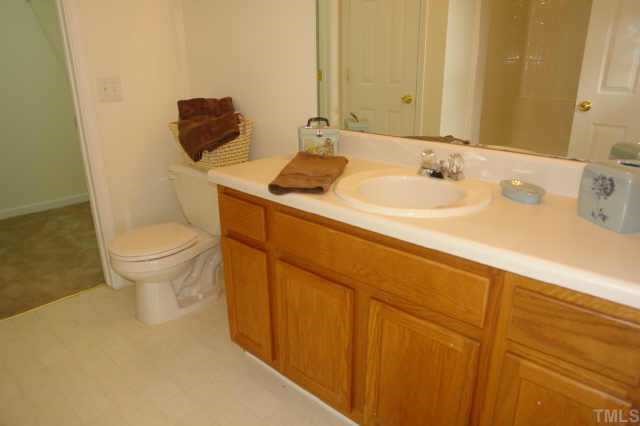 5525 Gateway Place Raleigh, NC 27617 - Photo 7 of 10 a bathroom with a sink and a toilet
