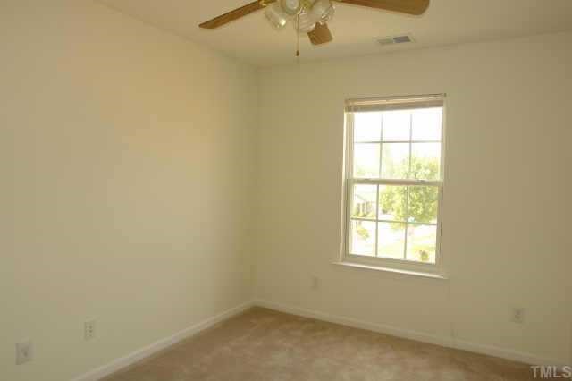5525 Gateway Place Raleigh, NC 27617 - Photo 9 of 10 an empty room with a window