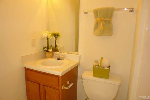5525 Gateway Place Raleigh, NC 27617 - Photo 10 of 10 a bathroom with a sink and a mirror