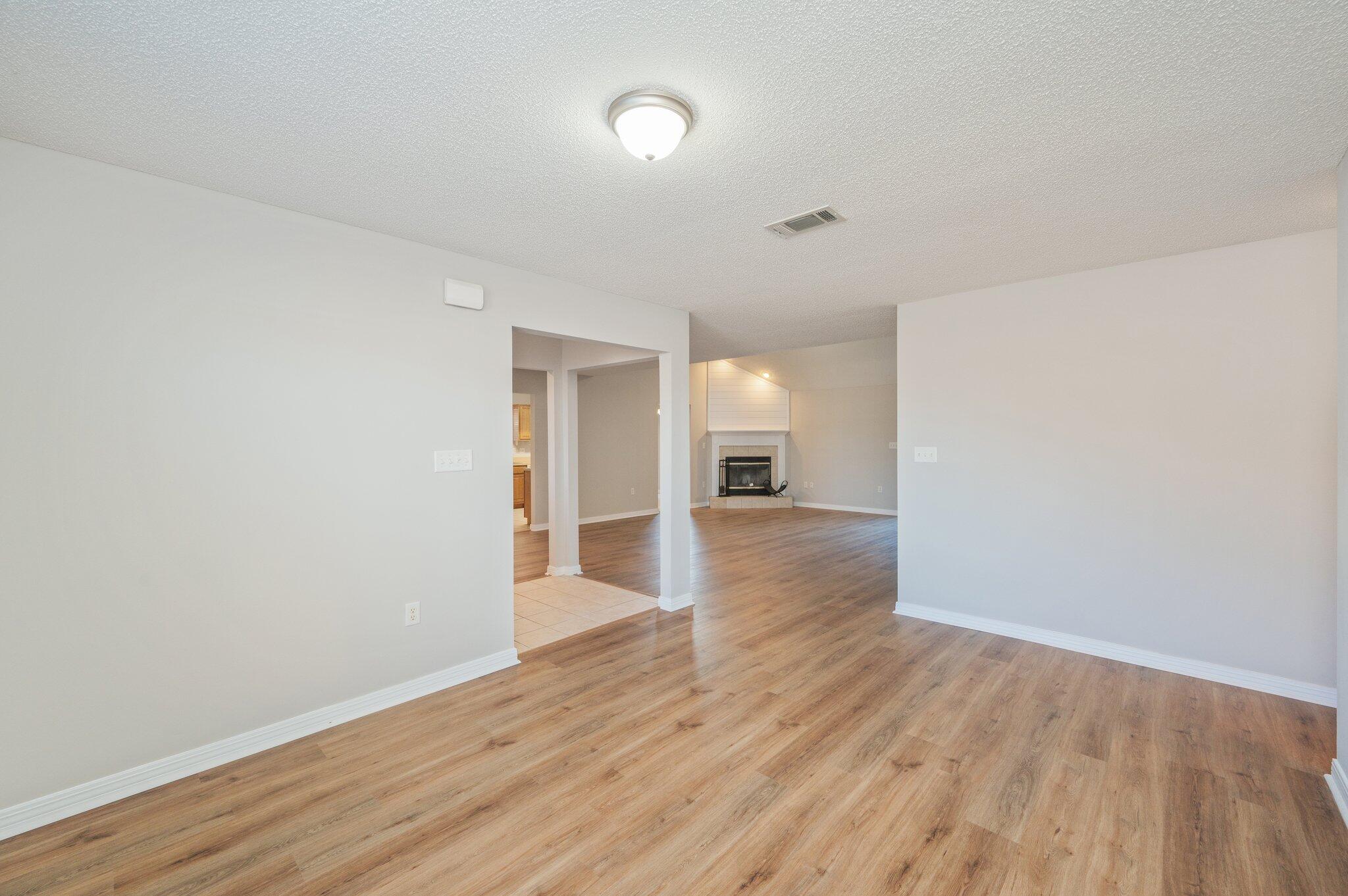 546 Tikell Drive Crestview, FL 32536 - Photo 19 of 20 a view of empty room with wooden floor