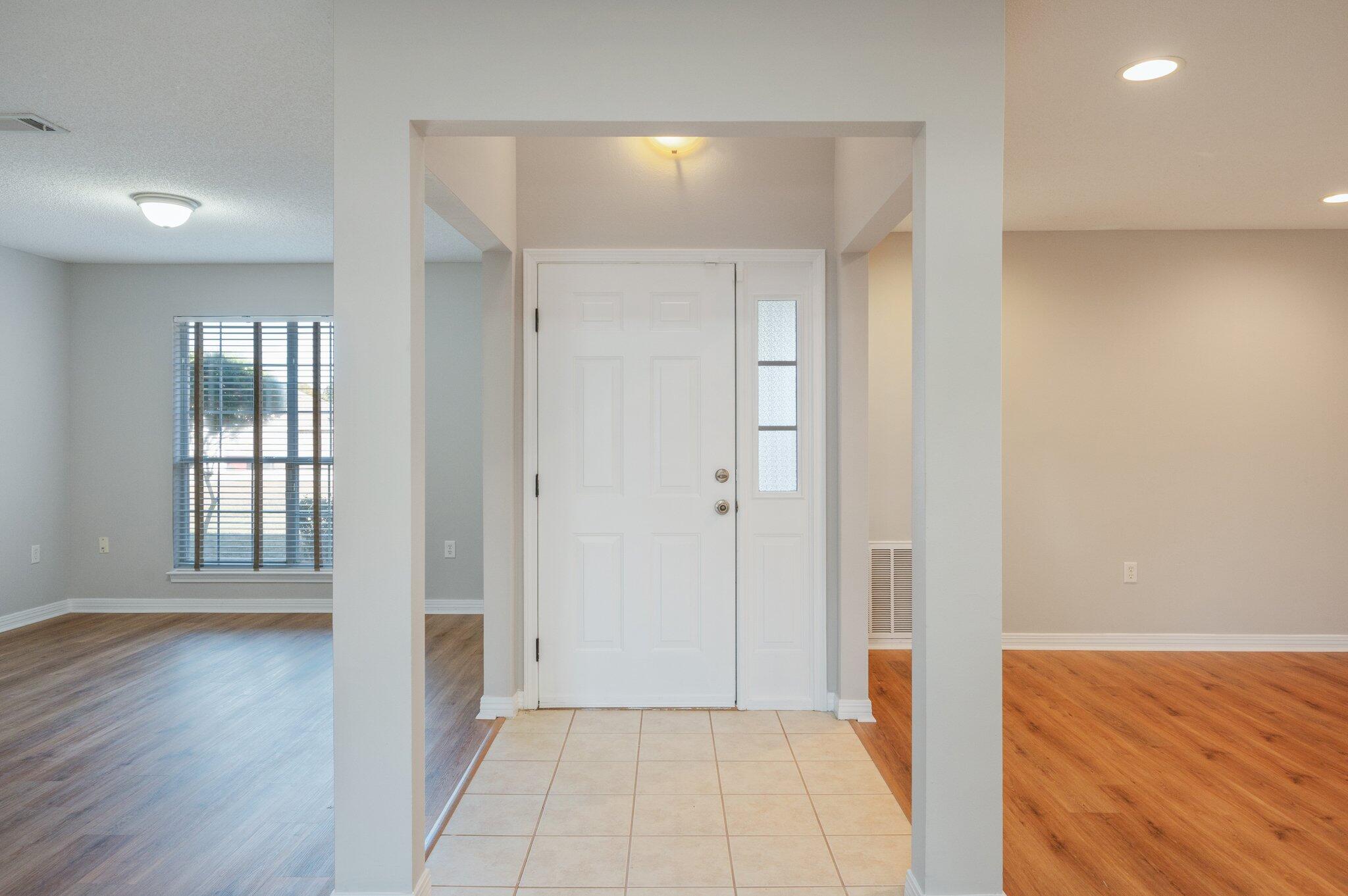 546 Tikell Drive Crestview, FL 32536 - Photo 5 of 20 wooden floor in an empty room with a window