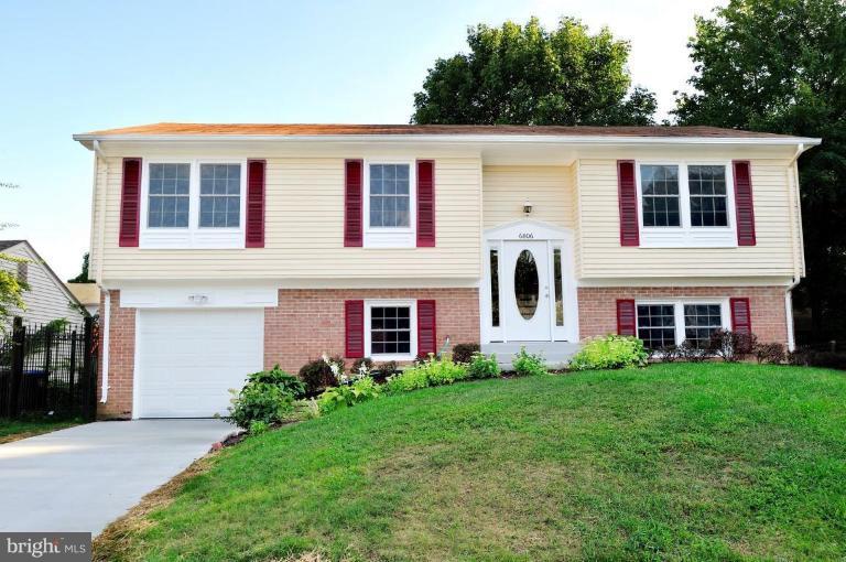 6806 Ben Franklin Road Springfield, VA 22150 - Photo 1 of 21 a front view of a house with garden