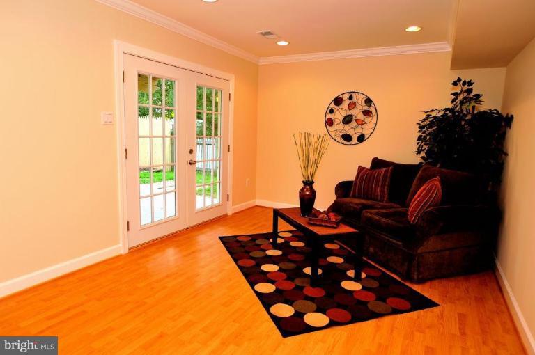 6806 Ben Franklin Road Springfield, VA 22150 - Photo 18 of 21 a living room with furniture and a large window