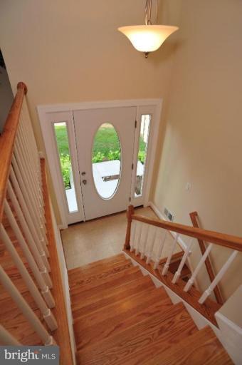 6806 Ben Franklin Road Springfield, VA 22150 - Photo 3 of 21 a view of a bedroom with wooden floor