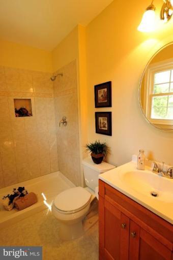 6806 Ben Franklin Road Springfield, VA 22150 - Photo 4 of 21 a bathroom with a sink a toilet and shower