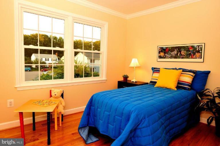 6806 Ben Franklin Road Springfield, VA 22150 - Photo 7 of 21 a bedroom with a bed and window