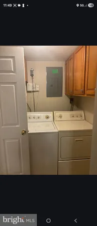 a utility room with a sink washer and dryer