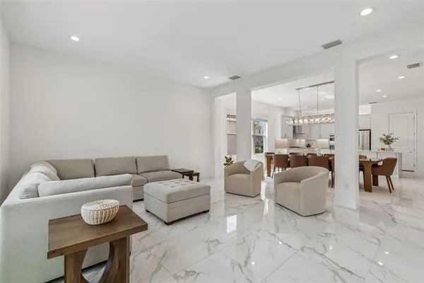 view of a hallway with wooden floor and staircase