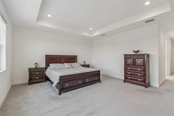 a bathroom with a sink a mirror toilet and shower