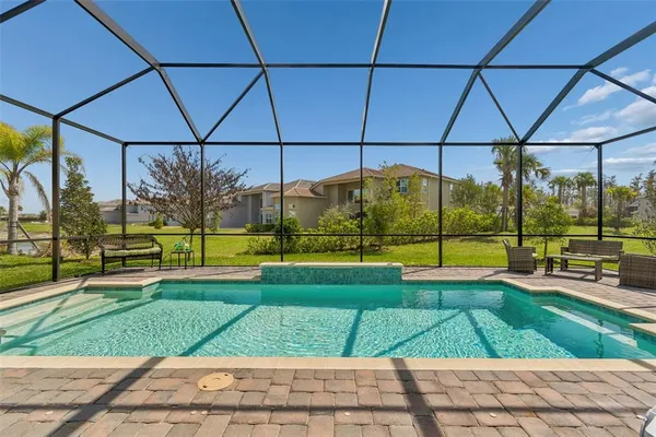 a living room with furniture and a dining table
