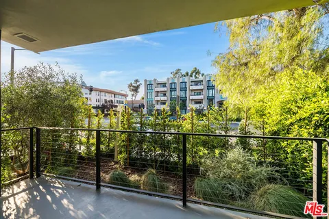 a view of a balcony with city view