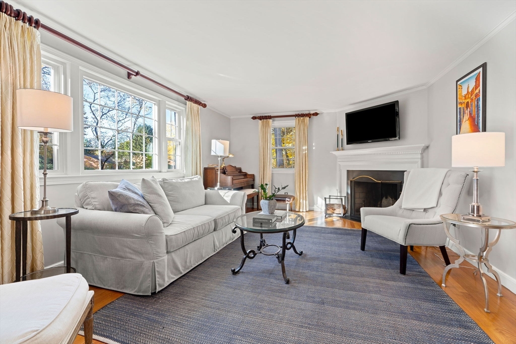 5 Fulton Road Andover, MA 01810 - Photo 12 of 27 a living room with furniture fireplace and a flat screen tv