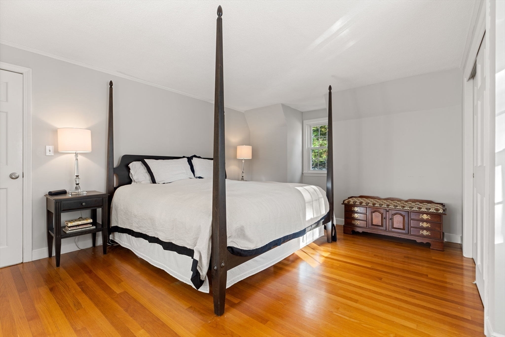 5 Fulton Road Andover, MA 01810 - Photo 16 of 27 a bedroom with a bed and a table