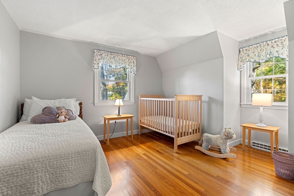 5 Fulton Road Andover, MA 01810 - Photo 18 of 27 a bedroom with two beds and a window