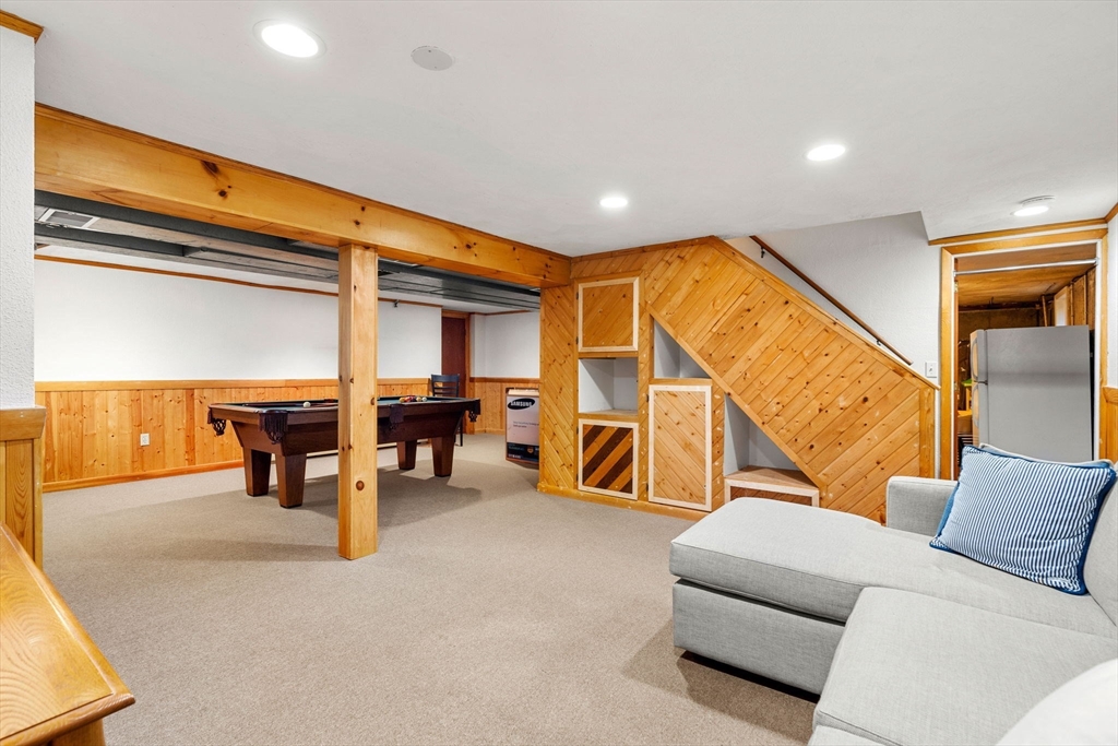 5 Fulton Road Andover, MA 01810 - Photo 22 of 27 a living room with furniture and a flat screen tv
