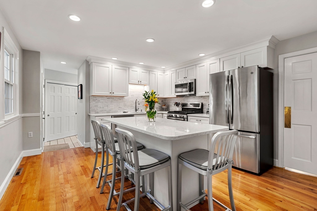 5 Fulton Road Andover, MA 01810 - Photo 7 of 27 a kitchen with stainless steel appliances a refrigerator and a stove top oven