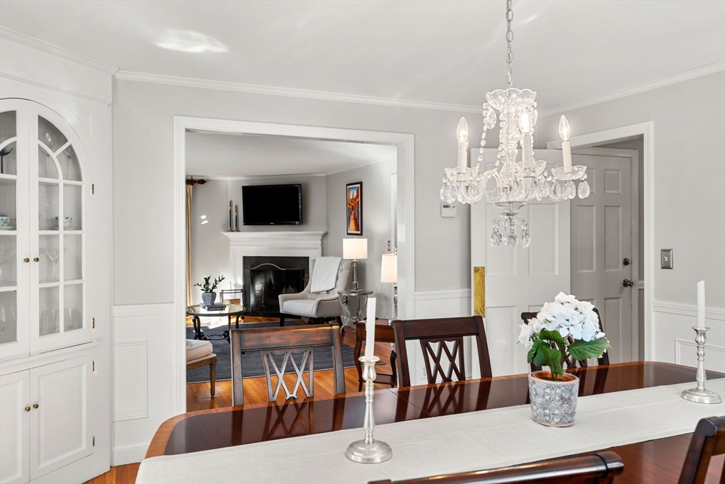 5 Fulton Road Andover, MA 01810 - Photo 8 of 27 a view of a dining room with furniture a chandelier and wooden floor