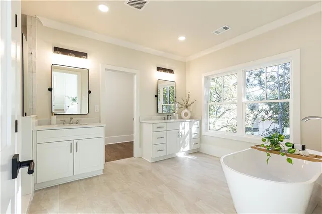 a dining room with furniture a chandelier and wooden floor