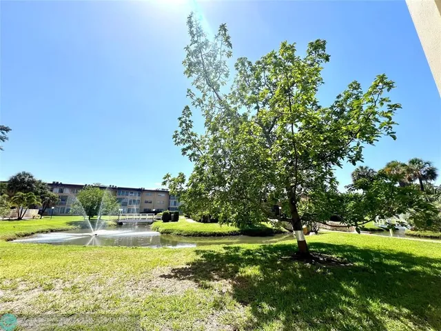 a view of a big yard with a swimming pool