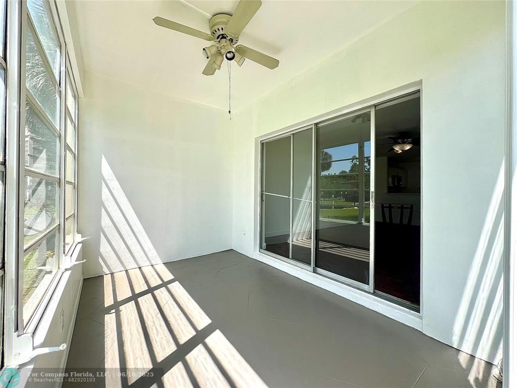 5001 West Oakland Park Boulevard, Unit 111 Lauderdale Lakes, FL 33313 - Photo 17 of 38 a view of an entryway with a floor to ceiling window