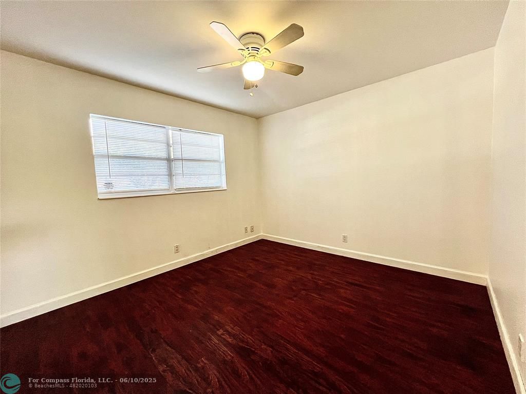 5001 West Oakland Park Boulevard, Unit 111 Lauderdale Lakes, FL 33313 - Photo 24 of 38 wooden floor in an empty room