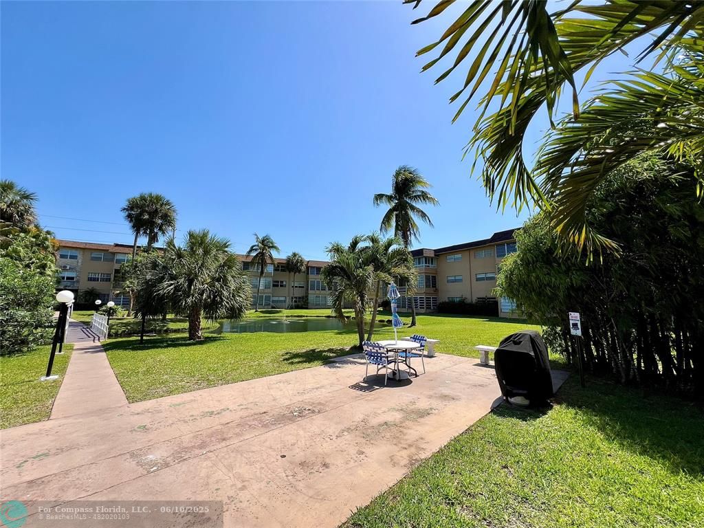 5001 West Oakland Park Boulevard, Unit 111 Lauderdale Lakes, FL 33313 - Photo 32 of 38 a view of a park with swings and slides