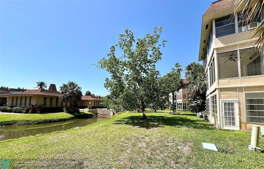 5001 West Oakland Park Boulevard, Unit 111 Lauderdale Lakes, FL 33313 - Photo 34 of 38 a view of a house with a yard