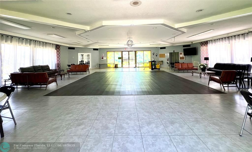 5001 West Oakland Park Boulevard, Unit 111 Lauderdale Lakes, FL 33313 - Photo 36 of 38 a living room with furniture and a large window