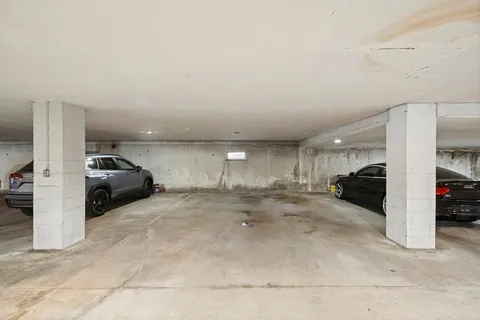 a view of parking area and car parked