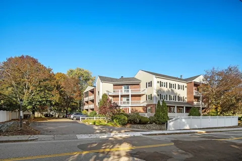 a front view of a building with a street